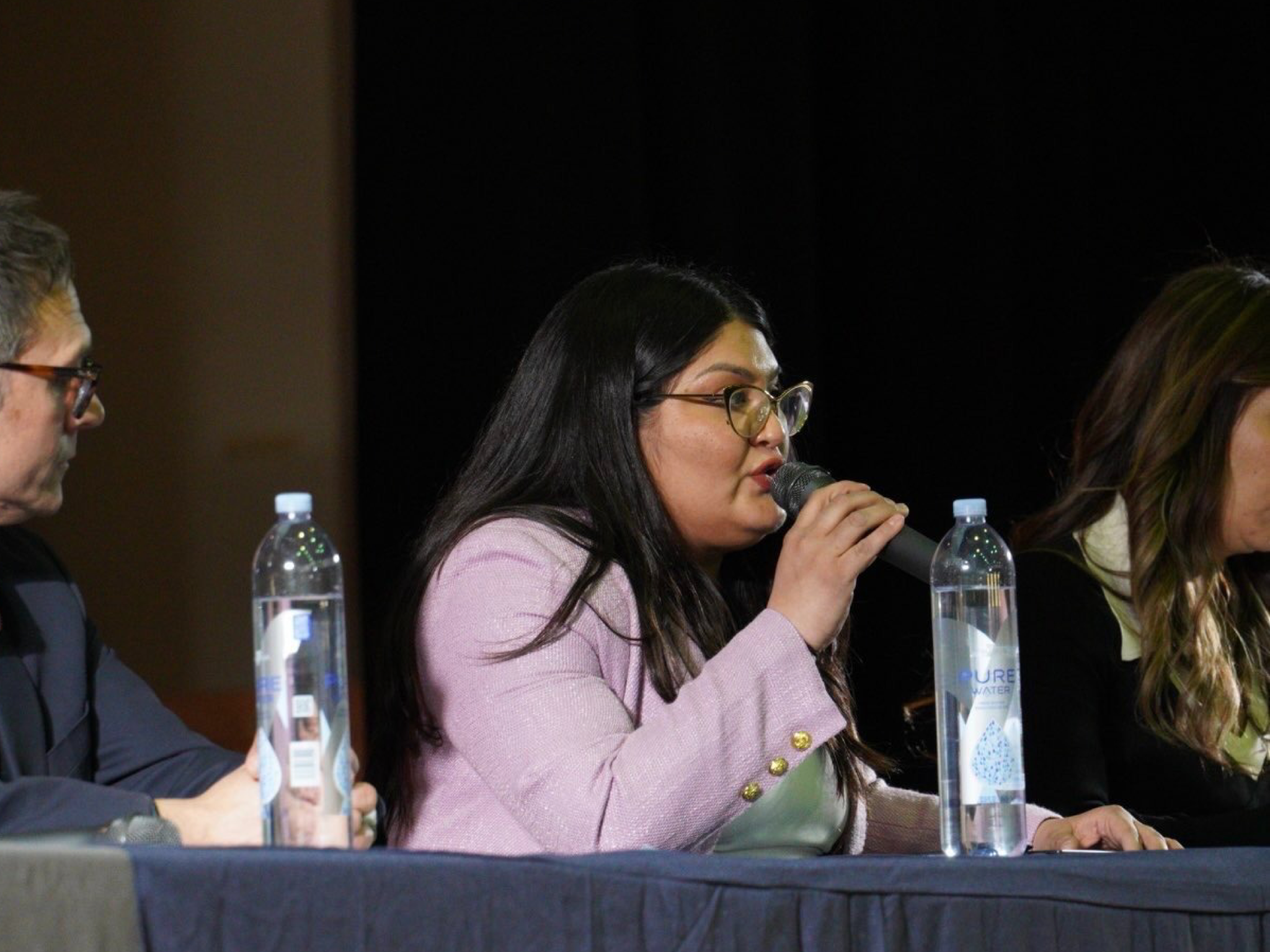 Graciela speaking at the District 20 debate at Roosevelt High School.